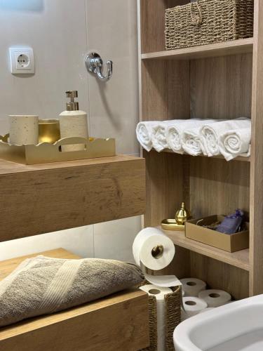 a bathroom with a sink and a toilet in it at Apartman Centar - Posušje in Posušje