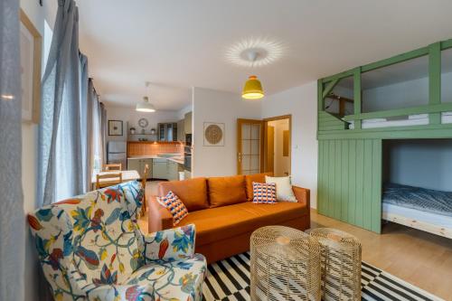 a living room with a couch and a bed at Boží Dar 95 in Boží Dar