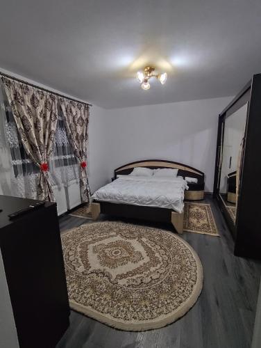 a bedroom with a bed and a large rug at La Elias in Breb