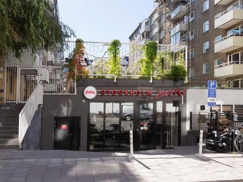 a store front with a sign on the side of a building at Stockholm Hostel in Stockholm