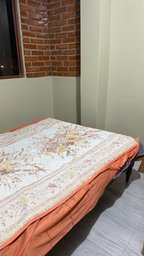 En eller flere senge i et værelse på Habitación Los Solises