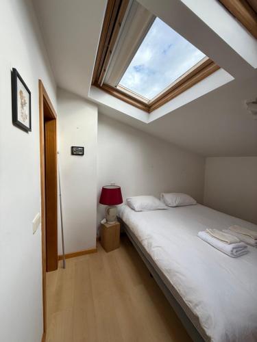 En eller flere senge i et værelse på Cozy Studio & Patio in Funchal