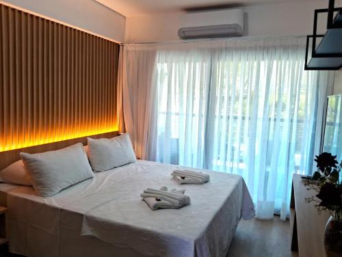 En eller flere senge i et værelse på Araça flat 308 - Lateral Vista Jardim