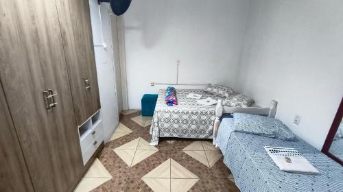 Ein Bett oder Betten in einem Zimmer der Unterkunft Pousada da Dinda - Casa Familiar