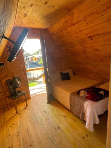 En eller flere senge i et værelse på Cabanas Faby 02