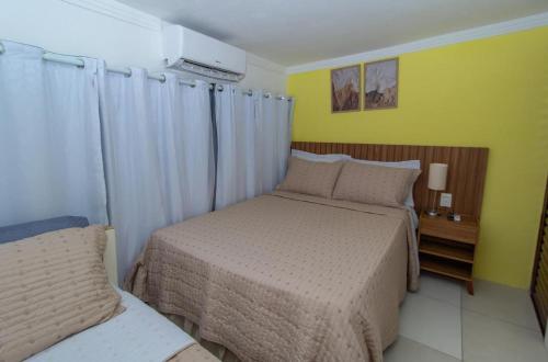 En eller flere senge i et værelse på Apartamento do Padin 2-2ª Praia