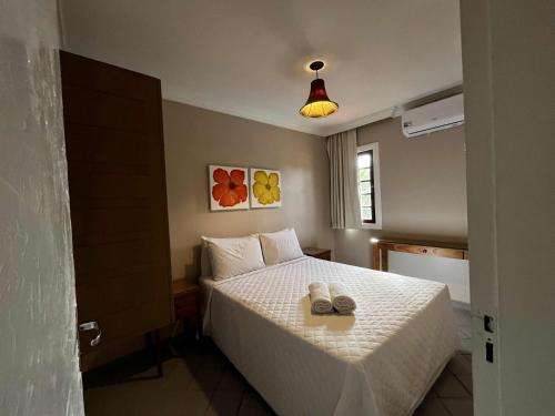 En eller flere senge i et værelse på Pousada Porto Mar