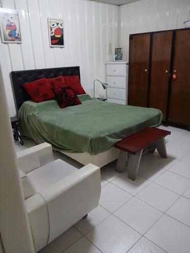 En eller flere senge i et værelse på Quinta Las Ardillas lujan