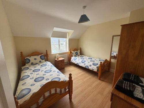 En eller flere senge i et værelse på Montbretia - Ballinskelligs