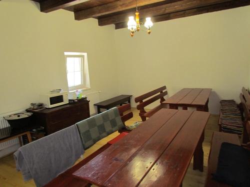 a living room with a wooden table and chairs at Ubytovanie V Súkromí Samuel in Myjava