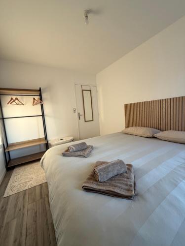 En eller flere senge i et værelse på CosyLoft