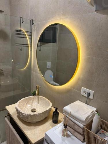 a bathroom with a sink and a mirror at Holiday home Lavande in Tivat