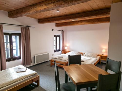 Postel nebo postele na pokoji v ubytování Pivovar Mlýn