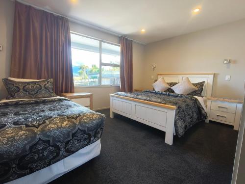 En eller flere senge i et værelse på Willowbank Motel