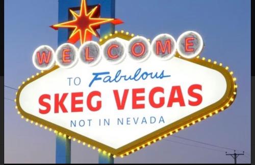 Et logo, certifikat, skilt eller en pris der bliver vist frem på Lamberts van