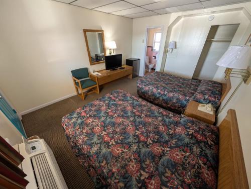 Ein Bett oder Betten in einem Zimmer der Unterkunft Relax Inn