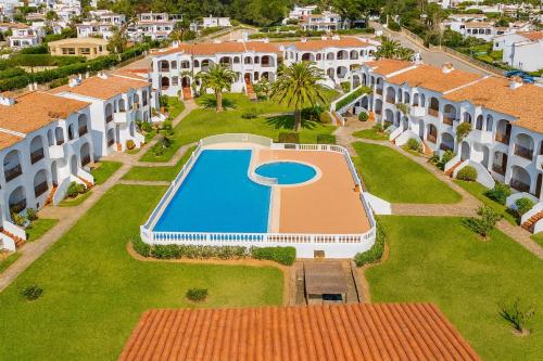 an aerial view of a villa with a swimming pool at Turquoise Menorca By the Sea in Son Bou
