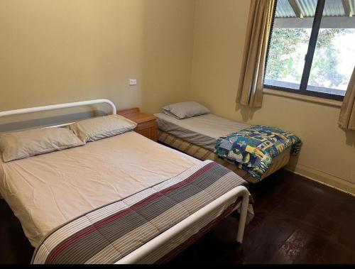 Postel nebo postele na pokoji v ubytování Wellington Forest Cottages & Bar