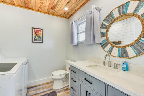 a bathroom with a sink and a toilet and a mirror at Near Beaches Waterfront Gem in Anna Maria Island! in Anna Maria Island