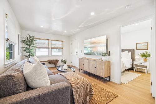 a living room with a couch and a bedroom at Casa Yano by The Beach in Santa Barbara