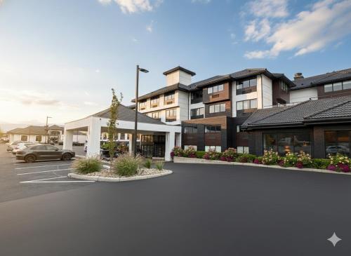 a parking lot in front of a building at Hotel Kelowna & Conference Centre in Kelowna