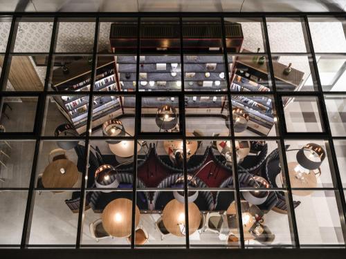 an overhead view of a room with a large window at ibis Styles Zurich City Center in Zürich