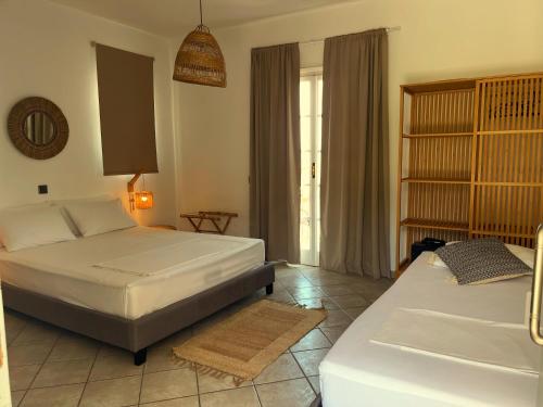 Postel nebo postele na pokoji v ubytování villa of the god