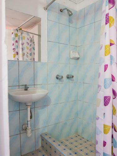a bathroom with a sink and a shower at Casona Cruz Verde in Arequipa