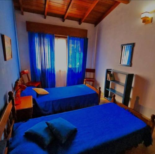 En eller flere senge i et værelse på chalet Mitre