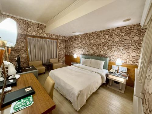 Postel nebo postele na pokoji v ubytování 種子商旅