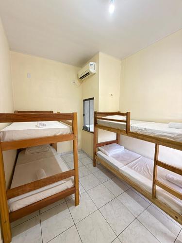 Postel nebo postele na pokoji v ubytování Hostel Solar da Pérola