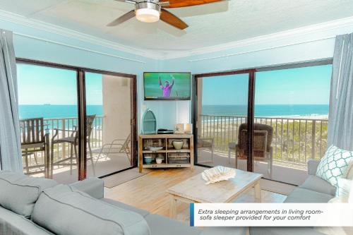 a living room with a view of the ocean at Canaveral Towers 401 in Cape Canaveral