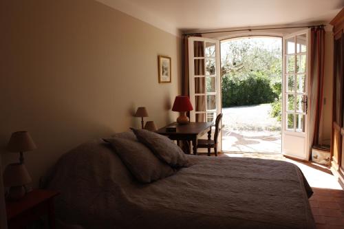 Giường trong phòng chung tại Bastide Selva