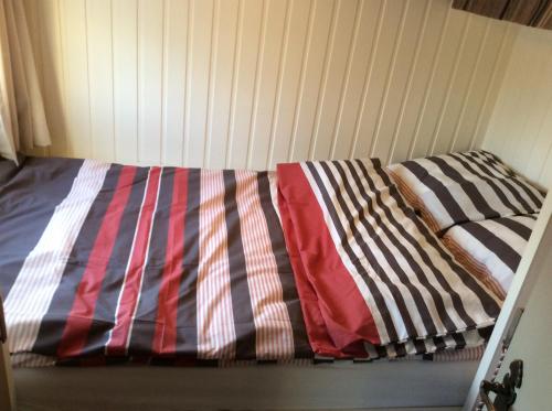 Een bed of bedden in een kamer bij Spits-Lucie B&B