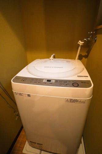 a toilet with a sink on top of it at Shirakabanoyado - SHIOKUSA, 白樺の宿 - 塩草 in Osaka