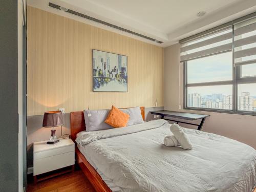 a bedroom with a large bed and a window at QMP - Vinhomes D'Capitale Tran Duy Hung in Hanoi