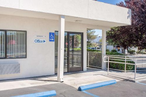 an open door of a building with a gate at Motel 6-Ukiah, CA in Ukiah