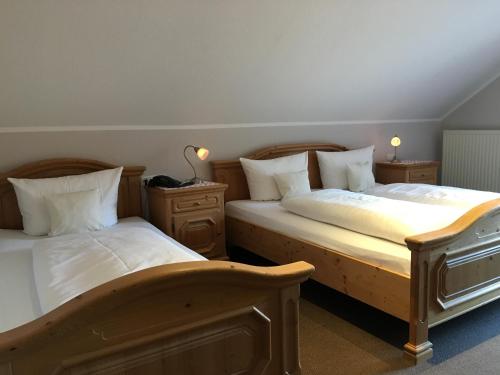 Ένα ή περισσότερα κρεβάτια σε δωμάτιο στο Landhaus Hotel Göke
