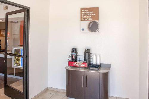 a room with a counter with a sign on the wall at Motel 6-Ukiah, CA in Ukiah