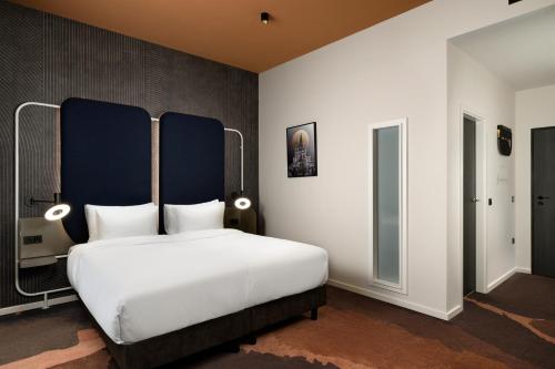 En eller flere senge i et værelse på You Hotel Budapest - Handwritten Collection