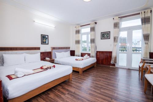 En eller flere senge i et værelse på ANH ĐÀO HOTEL