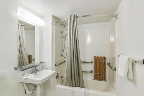 a white bathroom with a sink and a shower at Motel 6-Buellton, CA - Solvang Area in Buellton