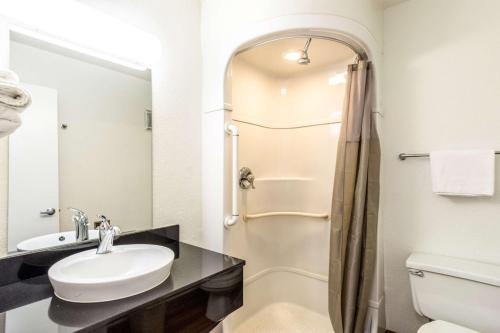 a bathroom with a sink and a shower at Motel 6-Redding, CA - Central in Redding