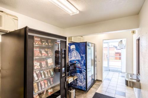 a large refrigerator in a room with food at Motel 6-Redding, CA - Central in Redding
