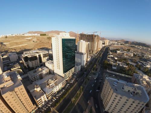 an aerial view of a city with tall buildings at Al Khulfaa Al Masy - فندق الخلفاء الماسي in Makkah