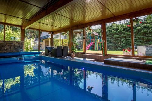 a swimming pool in a house at Willa Baciarka in Kościelisko