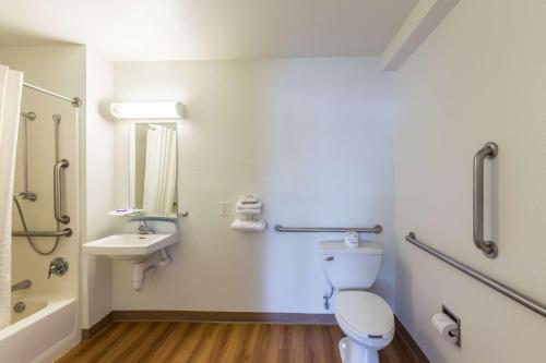 a bathroom with a toilet and a sink at Motel 6-Klamath Falls, OR in Klamath Falls