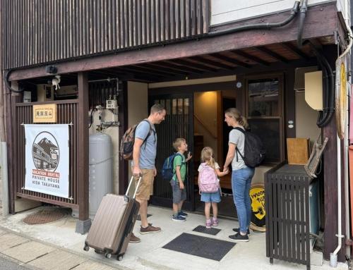 a group of people standing outside of a building at Private House HidaTakayama - Cozy Family Home in Takayama