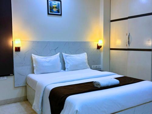 En eller flere senge i et værelse på Cassava Stay