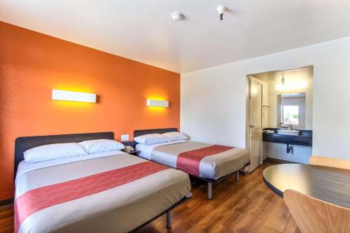 a hotel room with two beds and a bathroom at Motel 6-Watsonville, CA - Monterey Area in Watsonville
